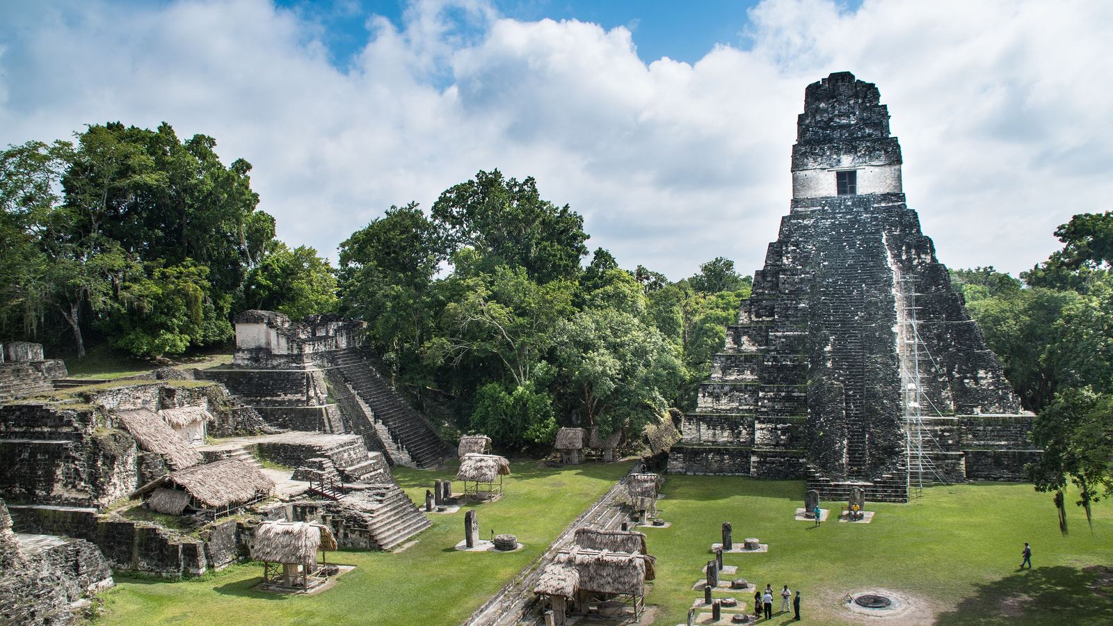 The Temple of the Great Jaguar (Temple I) above the lawn of the Gran Plaza in the Maya city of Tikal, surrounded by jungle