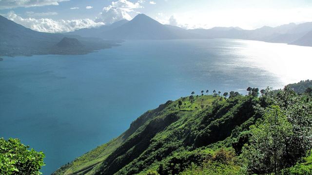 Lake Atitlán with volcanoes in the background