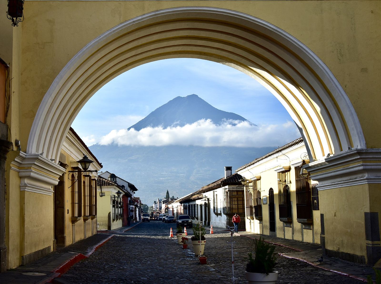 The yellow Santa Catalina arch with Agua volcano in Antigua
